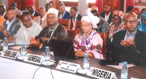 Officials seated at a regional cooperation meeting